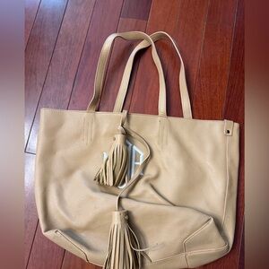 Elegant Tan Tote Bag with Tassel Accents
